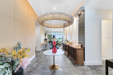 Step into the epitome of luxurious living with this exquisite on Eagle Creek Golf Club in Florida - for sale on GolfHomes.com, golf home, golf lot