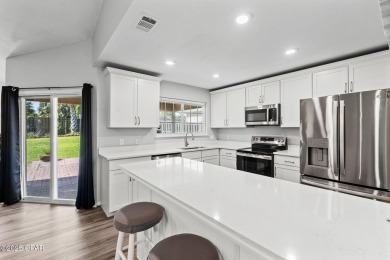 Charming Coastal Retreat - Fully Updated & Prime LocationWelcome on Holiday Golf Club in Florida - for sale on GolfHomes.com, golf home, golf lot