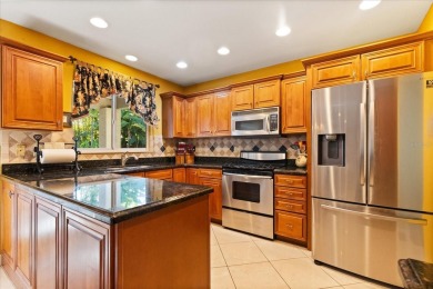 This beauty is priced to sell! Discover this spacious two-story on Carrollwood Country Club in Florida - for sale on GolfHomes.com, golf home, golf lot