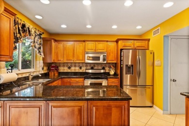 This beauty is priced to sell! Discover this spacious two-story on Carrollwood Country Club in Florida - for sale on GolfHomes.com, golf home, golf lot