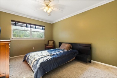 This beauty is priced to sell! Discover this spacious two-story on Carrollwood Country Club in Florida - for sale on GolfHomes.com, golf home, golf lot
