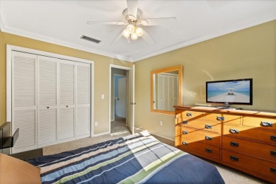 This beauty is priced to sell! Discover this spacious two-story on Carrollwood Country Club in Florida - for sale on GolfHomes.com, golf home, golf lot
