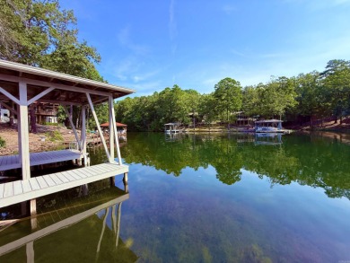 Discover lakeside living in this charming 2-bedroom, 1.5-bath on DeSoto Golf Course in Arkansas - for sale on GolfHomes.com, golf home, golf lot