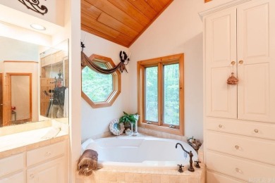 Nestled within the prestigious Tannenbaum Resort, this stunning on Tannenbaum Golf Club in Arkansas - for sale on GolfHomes.com, golf home, golf lot