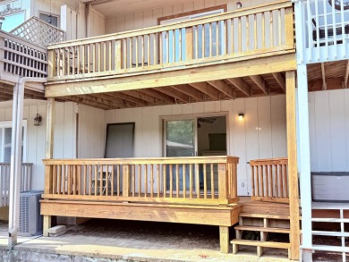 Discover lakeside living in this charming 2-bedroom, 1.5-bath on DeSoto Golf Course in Arkansas - for sale on GolfHomes.com, golf home, golf lot