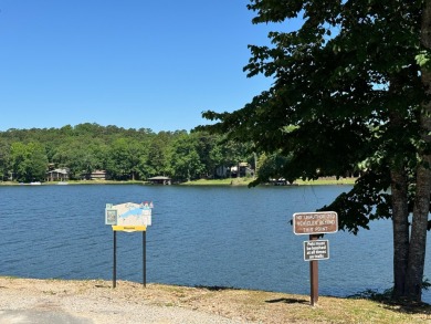 Discover lakeside living in this charming 2-bedroom, 1.5-bath on DeSoto Golf Course in Arkansas - for sale on GolfHomes.com, golf home, golf lot
