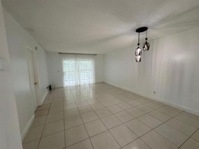 2/2 CONDOMINIUM FOR SALE IN DESIRABLE VERY ACTIVE COMMUNITY AT on Oriole Golf and Tennis Club in Florida - for sale on GolfHomes.com, golf home, golf lot