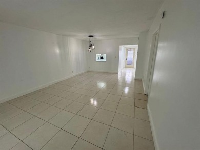 2/2 CONDOMINIUM FOR SALE IN DESIRABLE VERY ACTIVE COMMUNITY AT on Oriole Golf and Tennis Club in Florida - for sale on GolfHomes.com, golf home, golf lot