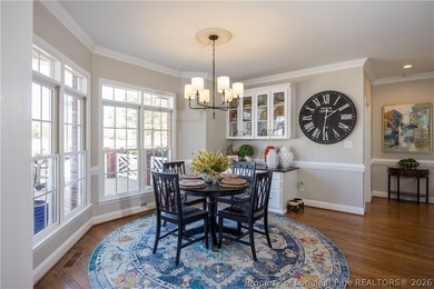 This beautifully updated custom brick home is located on Hole #1 on Sandy Ridge Country Club in North Carolina - for sale on GolfHomes.com, golf home, golf lot