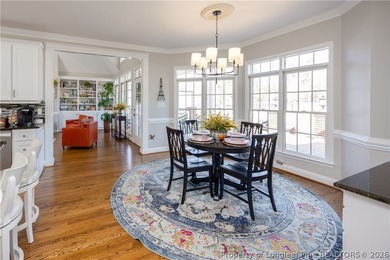 This beautifully updated custom brick home is located on Hole #1 on Sandy Ridge Country Club in North Carolina - for sale on GolfHomes.com, golf home, golf lot