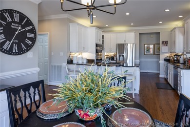 This beautifully updated custom brick home is located on Hole #1 on Sandy Ridge Country Club in North Carolina - for sale on GolfHomes.com, golf home, golf lot