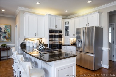 This beautifully updated custom brick home is located on Hole #1 on Sandy Ridge Country Club in North Carolina - for sale on GolfHomes.com, golf home, golf lot