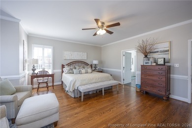 This beautifully updated custom brick home is located on Hole #1 on Sandy Ridge Country Club in North Carolina - for sale on GolfHomes.com, golf home, golf lot