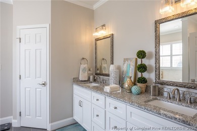 This beautifully updated custom brick home is located on Hole #1 on Sandy Ridge Country Club in North Carolina - for sale on GolfHomes.com, golf home, golf lot