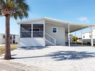 Located in the sought-after Caribbean Isles, this beautifully on Apollo Beach Golf and Sea Club in Florida - for sale on GolfHomes.com, golf home, golf lot