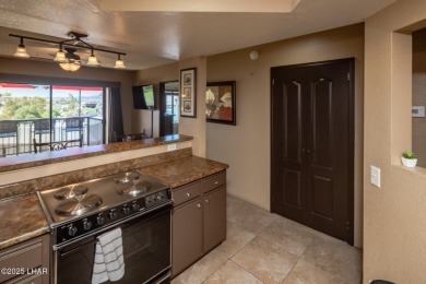 Desirable View Condo at Queensbay! This stunning lake-view condo on London Bridge Golf Course in Arizona - for sale on GolfHomes.com, golf home, golf lot