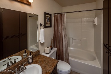 Desirable View Condo at Queensbay! This stunning lake-view condo on London Bridge Golf Course in Arizona - for sale on GolfHomes.com, golf home, golf lot