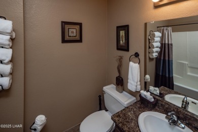 Desirable View Condo at Queensbay! This stunning lake-view condo on London Bridge Golf Course in Arizona - for sale on GolfHomes.com, golf home, golf lot