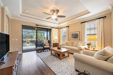 Discover the perfect balance of comfort and community in this on Esplanade Golf and Country at Lakewood Ranch in Florida - for sale on GolfHomes.com, golf home, golf lot