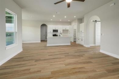 The Longhorn floorplan is spacious and open with patio and porch on Delaware Springs Golf Course in Texas - for sale on GolfHomes.com, golf home, golf lot