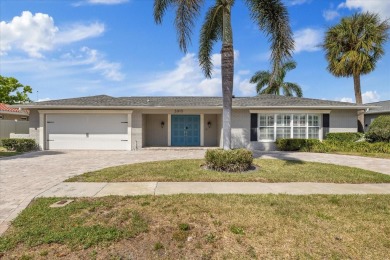 WATERFRONT POOL HOME in the coveted DANA SHORES community of on Rocky Point Golf Course in Florida - for sale on GolfHomes.com, golf home, golf lot