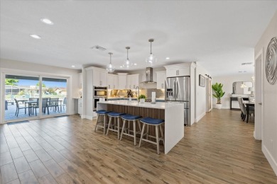 WATERFRONT POOL HOME in the coveted DANA SHORES community of on Rocky Point Golf Course in Florida - for sale on GolfHomes.com, golf home, golf lot