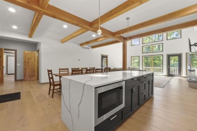Welcome to Chalet des Beagle--an exceptional ski-in/ski-out on Boyne Mountain Resort - Monument Course in Michigan - for sale on GolfHomes.com, golf home, golf lot