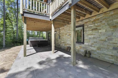 Welcome to Chalet des Beagle--an exceptional ski-in/ski-out on Boyne Mountain Resort - Monument Course in Michigan - for sale on GolfHomes.com, golf home, golf lot