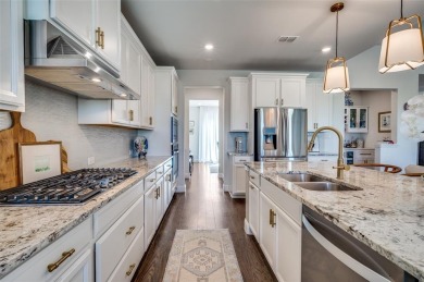 This STUNNING home is located in The Tribute- a premier golf on The Tribute At the Colony in Texas - for sale on GolfHomes.com, golf home, golf lot