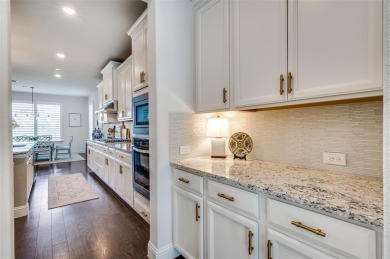 This STUNNING home is located in The Tribute- a premier golf on The Tribute At the Colony in Texas - for sale on GolfHomes.com, golf home, golf lot