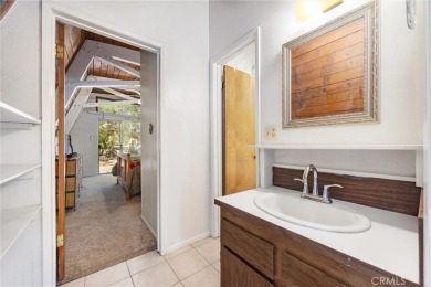 Tucked into a sunny, quiet corner of Pine Mountain Club, this on Pine Mountain Club in California - for sale on GolfHomes.com, golf home, golf lot