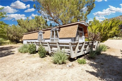 Tucked into a sunny, quiet corner of Pine Mountain Club, this on Pine Mountain Club in California - for sale on GolfHomes.com, golf home, golf lot