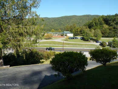 Sit on your front porch and love the Eastern Kentucky fall views on Wasioto Winds in Kentucky - for sale on GolfHomes.com, golf home, golf lot