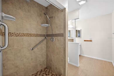 Live the carefree Florida lifestyle in this spacious 2-bedroom on Sandpiper Golf Club in Florida - for sale on GolfHomes.com, golf home, golf lot