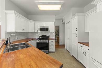 Move-in ready and beautifully updated Whitney Ranch Quad in on Carillon Lakes 3 Hole Course in Illinois - for sale on GolfHomes.com, golf home, golf lot