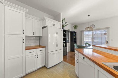 Move-in ready and beautifully updated Whitney Ranch Quad in on Carillon Lakes 3 Hole Course in Illinois - for sale on GolfHomes.com, golf home, golf lot