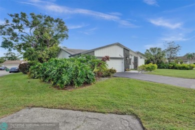 Welcome To This Stunning 3 Bedrooms 2.5 Bath Home With No HOA In on Woodmont Country Club in Florida - for sale on GolfHomes.com, golf home, golf lot