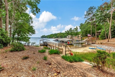 KEOWEE KEY LAKEFRONT HOME ON LEVEL LOT & BEACH! COVERED DOCK IN on Keowee Key Golf and Country Club in South Carolina - for sale on GolfHomes.com, golf home, golf lot