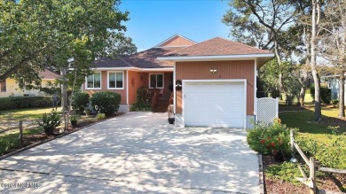 Enjoy true Coastal living at this stunning 3 bedroom, 2-bath on Oak Island Golf Club in North Carolina - for sale on GolfHomes.com, golf home, golf lot