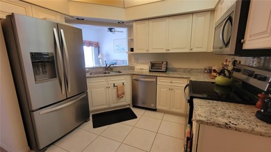 This beautiful pond view 2-bedroom, 2-bath first floor condo on on Tara Golf and Country Club in Florida - for sale on GolfHomes.com, golf home, golf lot