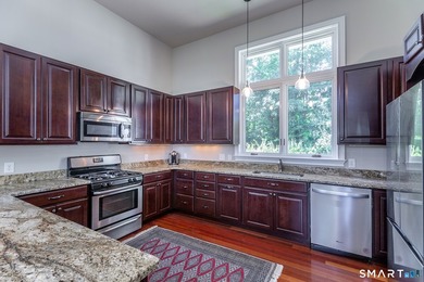 A spacious contemporary located in a resort quality setting on The Club at River Oaks in Connecticut - for sale on GolfHomes.com, golf home, golf lot