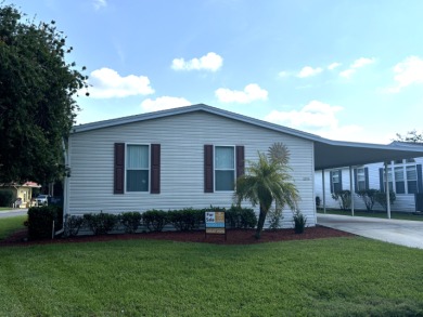 This home is located within a 55+ resort style leased land on Big Cypress Golf and Country Club in Florida - for sale on GolfHomes.com, golf home, golf lot