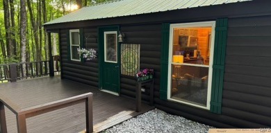 Discover the charm of this cozy tiny log home nestled in the on Cedar Lake Club in New York - for sale on GolfHomes.com, golf home, golf lot