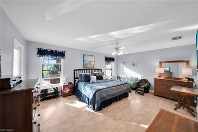 Stunningly Updated 4-Bedroom, 2-Bathroom WATERFRONT home located on Del Tura Golf and Country Club in Florida - for sale on GolfHomes.com, golf home, golf lot