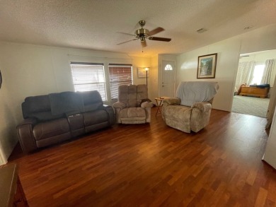 Experience comfort and community at the delightful Whispering on Lily Lake Golf and RV Resort in Florida - for sale on GolfHomes.com, golf home, golf lot