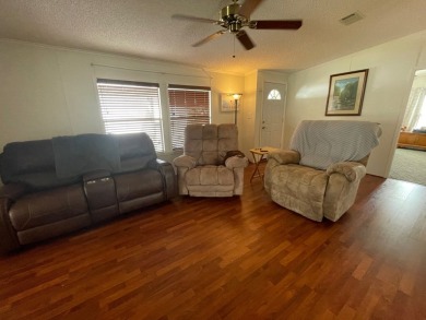 Experience comfort and community at the delightful Whispering on Lily Lake Golf and RV Resort in Florida - for sale on GolfHomes.com, golf home, golf lot