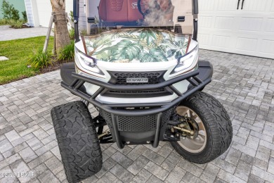 What goes with Lime? Coconut and a $15K 2024 Venom 4P EV Golf on LPGA International Golf Course in Florida - for sale on GolfHomes.com, golf home, golf lot