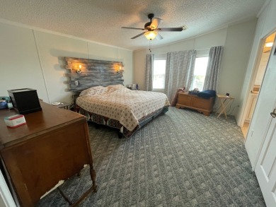 Experience comfort and community at the delightful Whispering on Lily Lake Golf and RV Resort in Florida - for sale on GolfHomes.com, golf home, golf lot