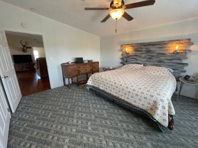 Experience comfort and community at the delightful Whispering on Lily Lake Golf and RV Resort in Florida - for sale on GolfHomes.com, golf home, golf lot