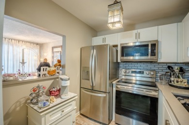 Recently renovated modern condo with new kitchen cabinets on Hillsboro Pines Golf in Florida - for sale on GolfHomes.com, golf home, golf lot